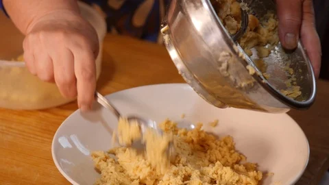 Pour chickpeas into a dish Stock Footage 98694440