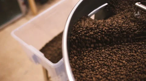 Pour coffee beans after roasting. Close-up Video stock 58957584
