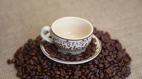 Pour coffee benas into the cup Stock Footage 56286780