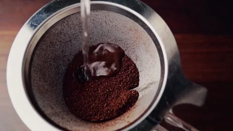 Pour coffee brewed on metallic filter Stock Footage 131445640