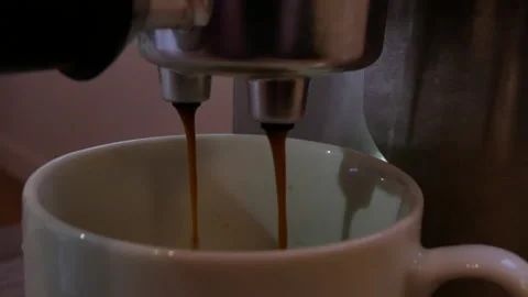Pour coffee from a coffee machine Stock Footage 166545404