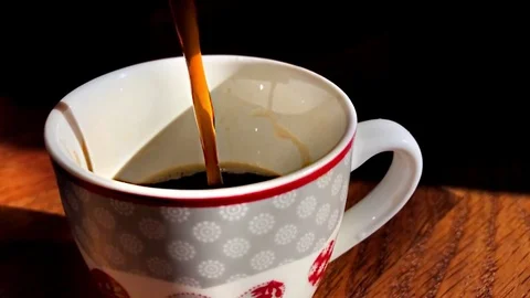 Pour the coffee in the cup Stock Footage 71618269