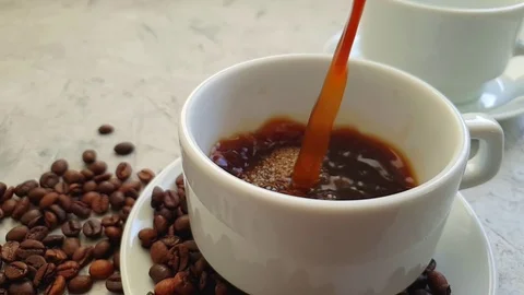 Pour coffee into a cup Video stock 117411884