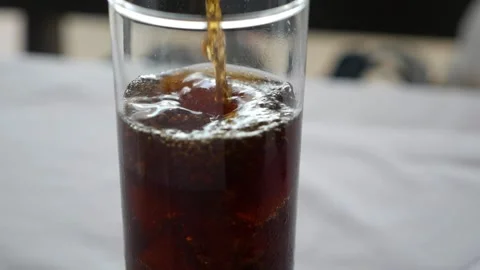 Pour the cola into a glass Stock Footage 158290590