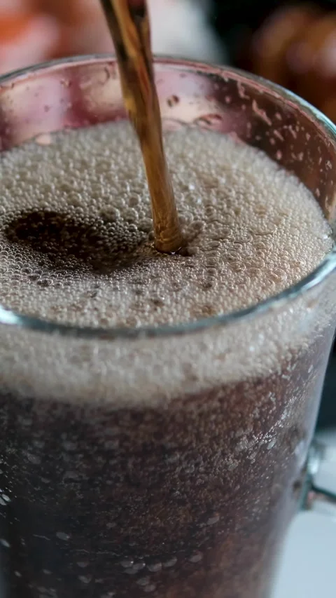 Pour cola sushi set cola being poured into a glass on the table with visible Stock Footage 346189424