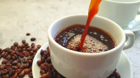 Pour a cup of coffee on a concrete background Stock Footage 117411995