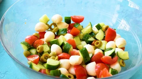 Pour dressing on the fresh salad Stock Footage 92236354
