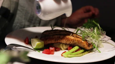 Pour dressing on grilled salmon. Stock Footage 276609068