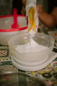 Pour the flour into the baking scale Stock Photos