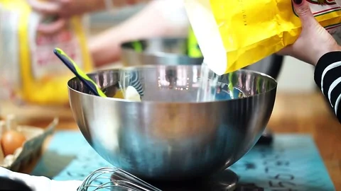 Pour the flour into kitchen scales. A baker makes the cake Video stock 72256878