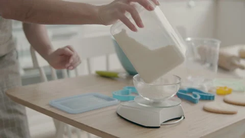 Pour flour into the weighing Stock Footage 148278523
