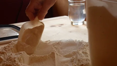 Pour the flour on the work table Stock Footage 112879818