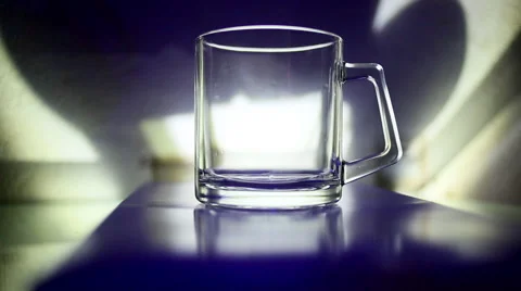 Pour into a glass of clear liquid active light Stock Footage 44505068