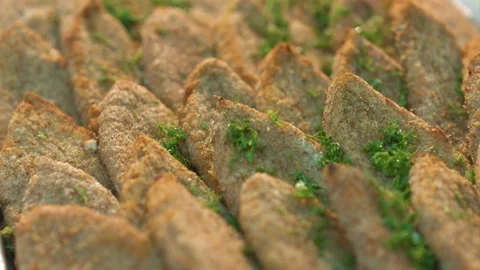 Pour greens on the cutlet Stock Footage 134470485