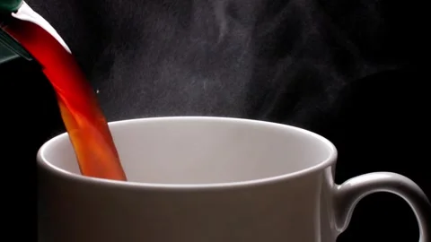 Pour hot coffee into a cup Stock Footage 259604110