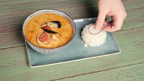 Pour the hot soup into a plate Stock Footage 170233046