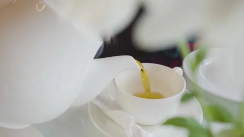 Pour hot tea in cup. Drink tea ceremony Stock-Footage 145189783