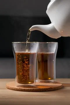 Pour hot tea Stock Photos