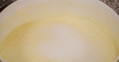 Pour icing sugar into the cream Stock Footage 129154692