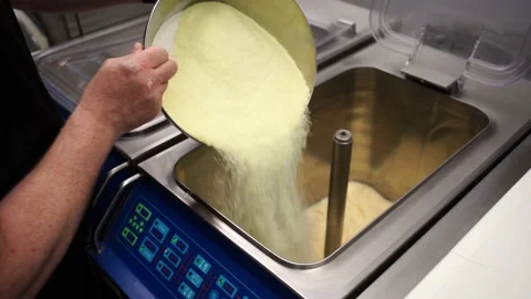 Pour ingredients into the pasteurizer Stock Footage 143666324