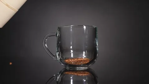 Pour instant coffee in a mug with boiling water. Slow motion Video stock 249227552
