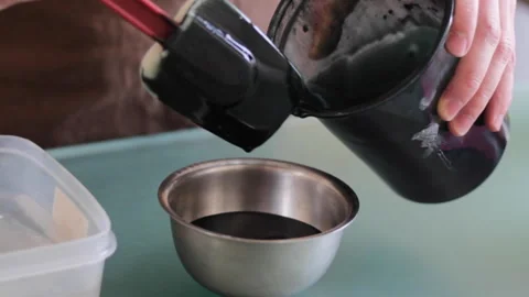 Pour liquid chocolate into mold Stock Footage 230707363