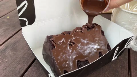 Pour Melted Chocolate onto Cake Stock Footage 168855979