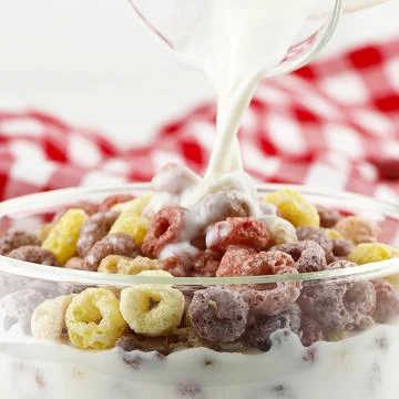 Pour Milk on Fruit Loops Cereal Stock Photos