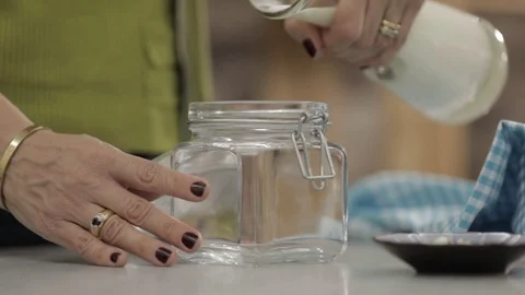 Pour milk in slow motion Stock Footage 76372427