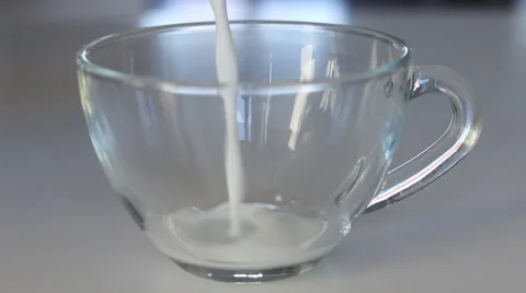 Pour the milk in a transparent Cup Stock Footage 59827424