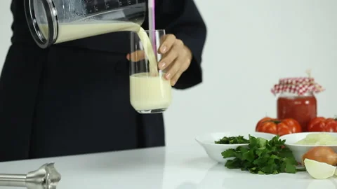Pour milkshake into a glass Stock Footage 270231232