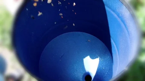 Pour a mixture of grain mixed fodder into the grain crusher Stock Footage 78054834