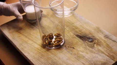 Pour the nuts and cream into the blender. I prepare Mexican Stuffed Poblano Stock Footage 157781412
