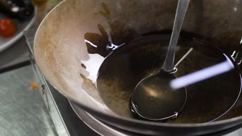 Pour the oil into the pan. Stock Footage 190899056