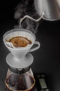Pour-over alternative method of making coffee. Filter coffee brewing on black Stock Photos