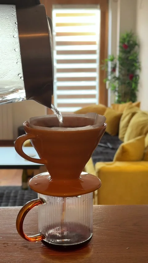 Pour Over Coffee Brewing at Home in Cozy Sunlit Living Room Stock Footage 335811408