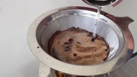 Pour Over Coffee Brewing Process  Close Up of Hot Water Pouring Over Dark C.. Video stock 313542555