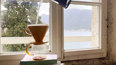 Pour Over Coffee Brewing by Rainy Window on a Cozy Morning Video stock 335880387