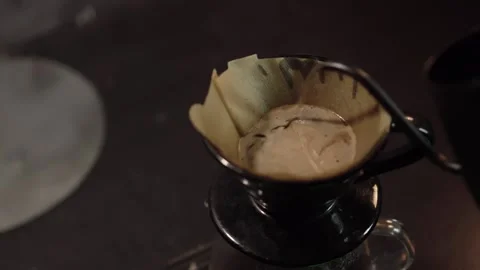Pour Over Coffee Process Creating Natural Crema in V60 Dripper. Manual pour.. Stock Footage 306295149