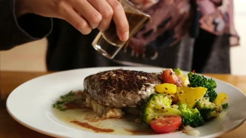 Pour Sauce At Meat Tiger Cry Stock Footage 145104485