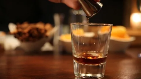 Pour shot whiskey Stock Footage 77602169