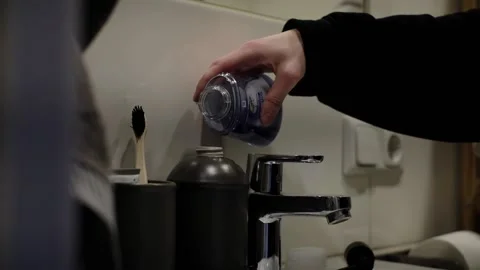 Pour the soap into the soap dish Video stock 233512825