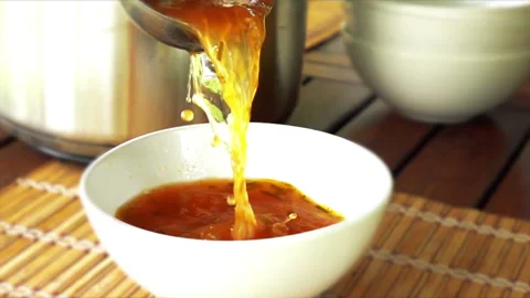 Pour the soup into a plate Stock Footage 102179760