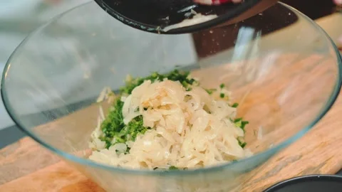 Pour the stewed cabbage over the dill Stock Footage 252208394