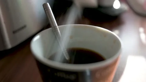 Pour sugar into a coffee mug Stock Footage 132282229