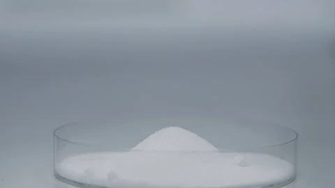 Pour Sugar into glass container close up slowmotion Stock-Footage 247403066