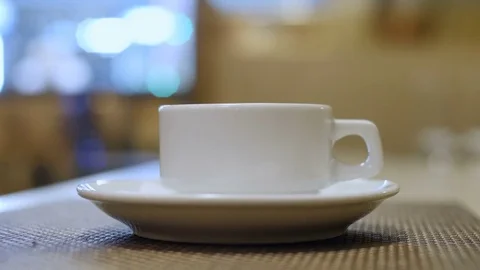 Pour tea into a cup. A cafe. Bokeh. Stock Footage 73034139