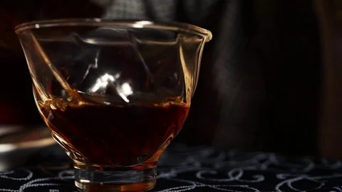 Pour tea into the cup Stock Footage 99136633