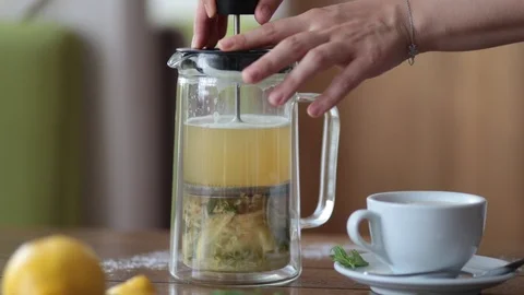 Pour tea with lemon into a Cup Video stock 111854618