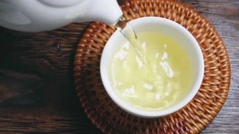 Pour tea tea water tea cup close-up Stock Footage 234498328